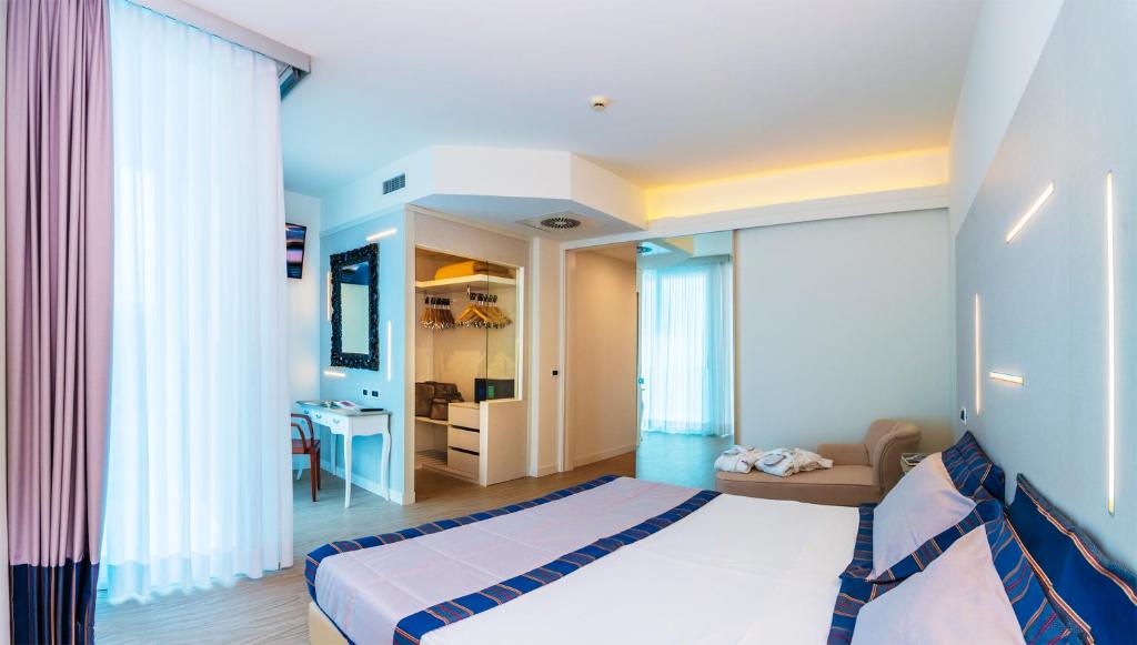 A bed or beds in a room at Hotel Panoramic