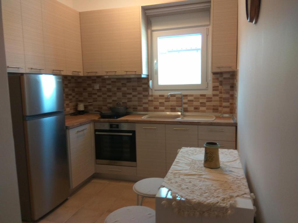 Kuchyň nebo kuchyňský kout v ubytování Eirini's Place