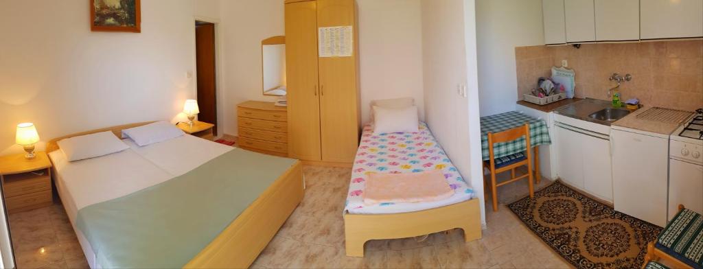 Postel nebo postele na pokoji v ubytování Apartments Butkovic