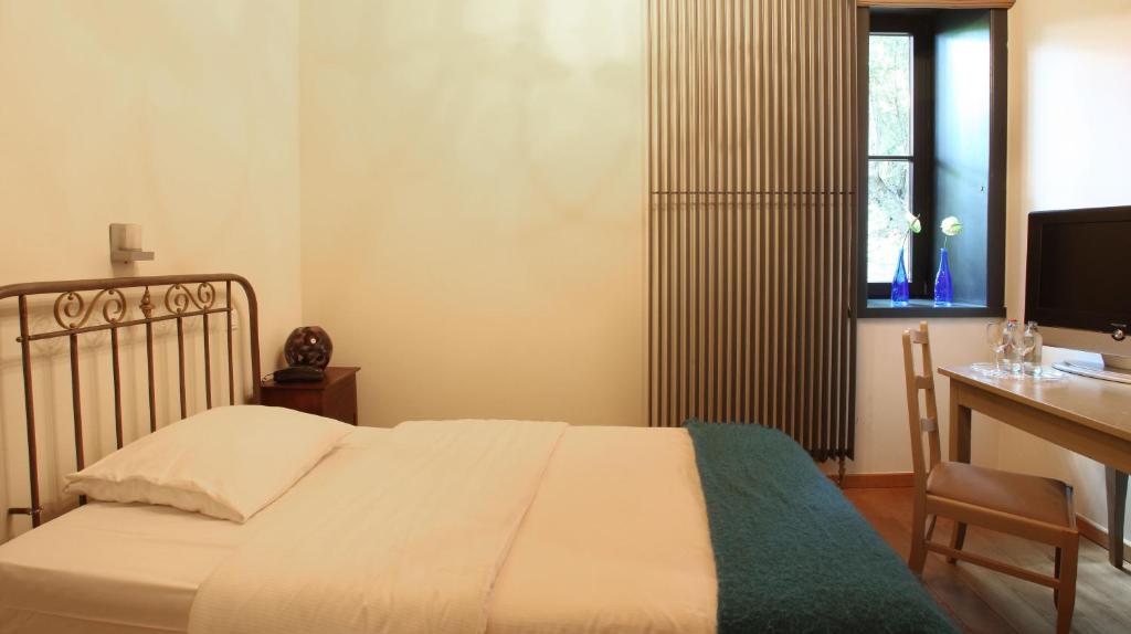 Ένα ή περισσότερα κρεβάτια σε δωμάτιο στο Hotel The Lodge Heverlee
