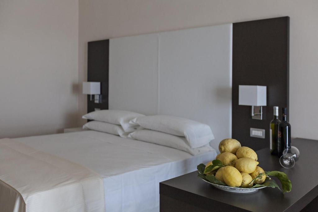 Postel nebo postele na pokoji v ubytování Eco Resort Dei Siriti