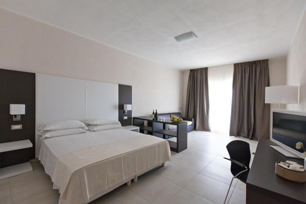 Postel nebo postele na pokoji v ubytování Eco Resort Dei Siriti