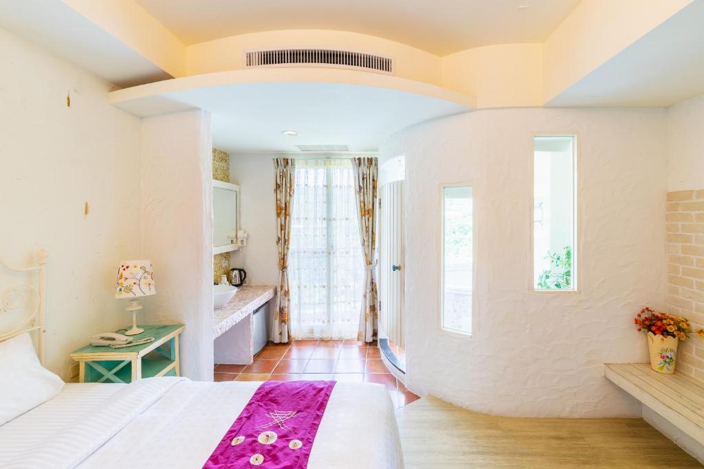 Una cama o camas en una habitación de Mong Shan Homestay