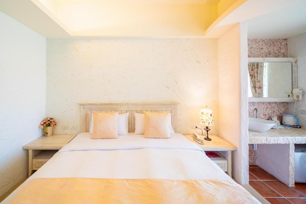 Una cama o camas en una habitación de Mong Shan Homestay