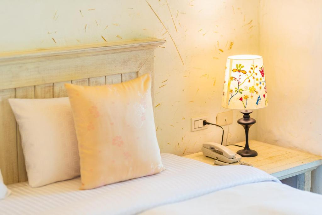 Una cama o camas en una habitación de Mong Shan Homestay
