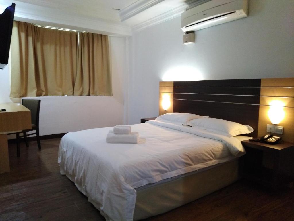 Postel nebo postele na pokoji v ubytování Sara Hotel