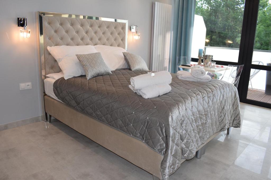 Posteľ alebo postele v izbe v ubytovaní Apartament Silence Triventi Cristal
