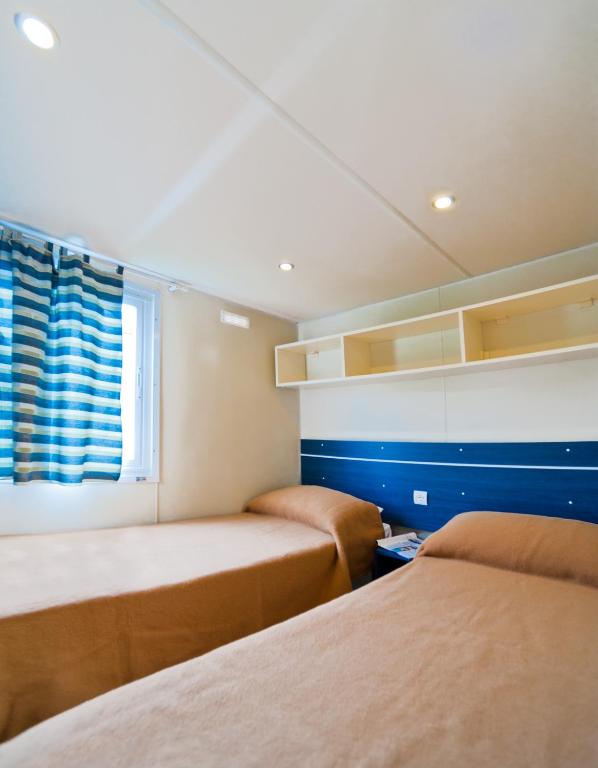 Postel nebo postele na pokoji v ubytování Camping Lido