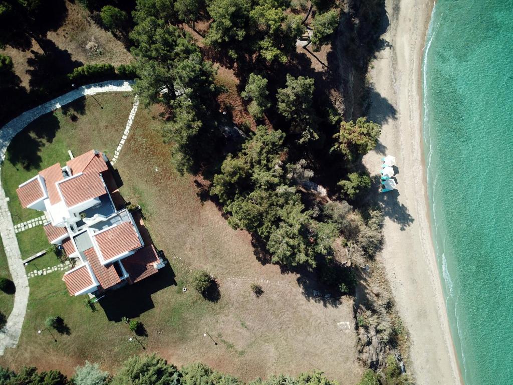 an aerial view of a house on the beach at Summerday Villa Private Beach in Nea Iraklia