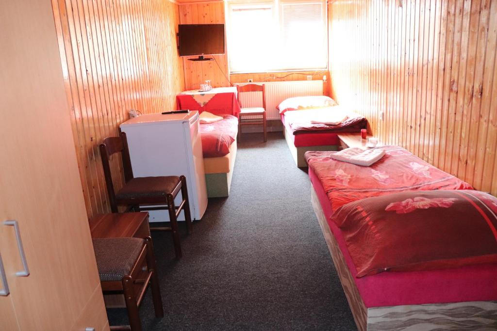 Postel nebo postele na pokoji v ubytování Hotel u Nádraží Lanžhot
