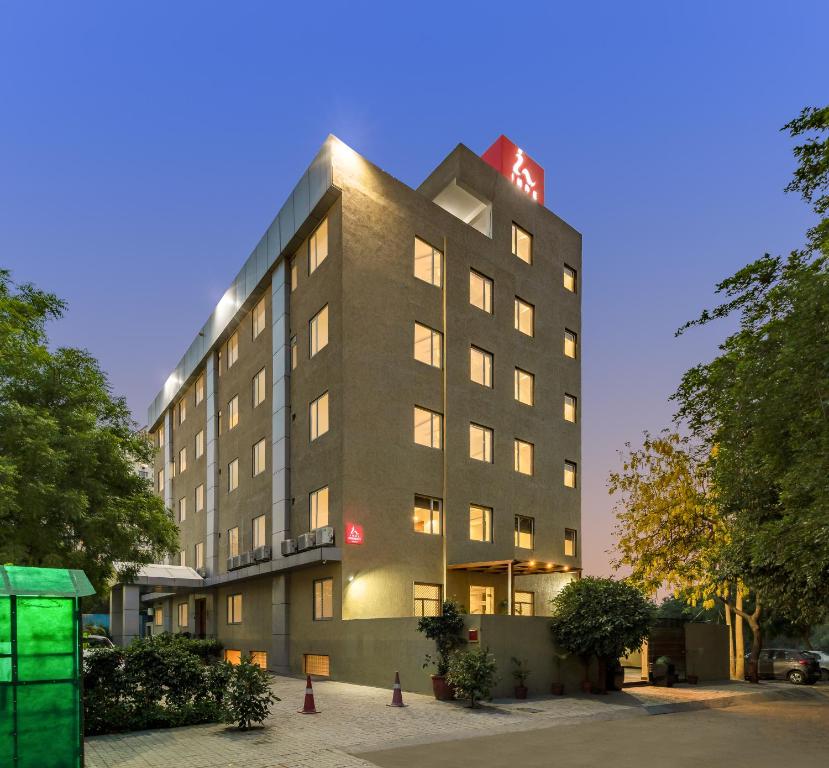 a building with a clock on top of it at Inde Hotel Cyber City in Gurgaon