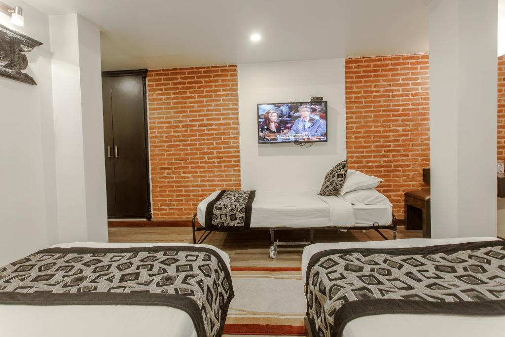 Postel nebo postele na pokoji v ubytování Hotel Shreesu