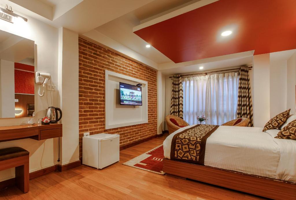 TV a/nebo společenská místnost v ubytování Hotel Shreesu