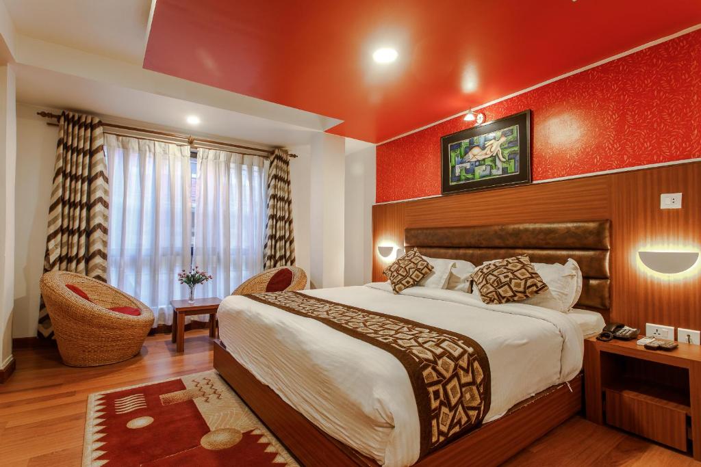 Postel nebo postele na pokoji v ubytování Hotel Shreesu