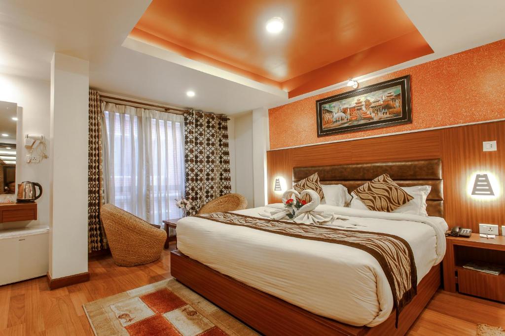 Postel nebo postele na pokoji v ubytování Hotel Shreesu