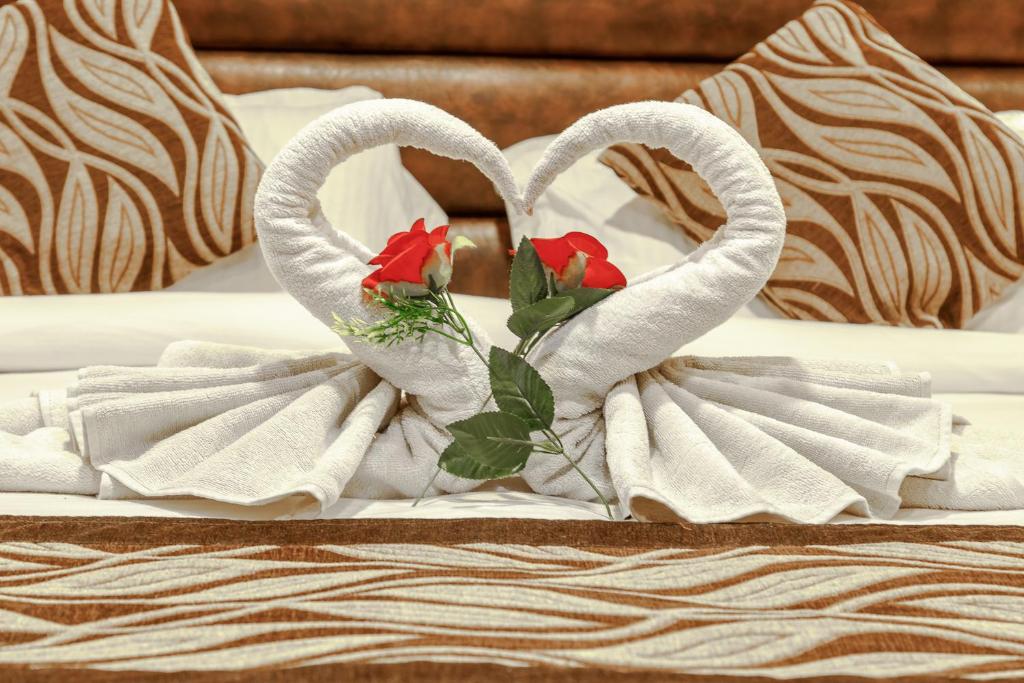 Postel nebo postele na pokoji v ubytování Hotel Shreesu