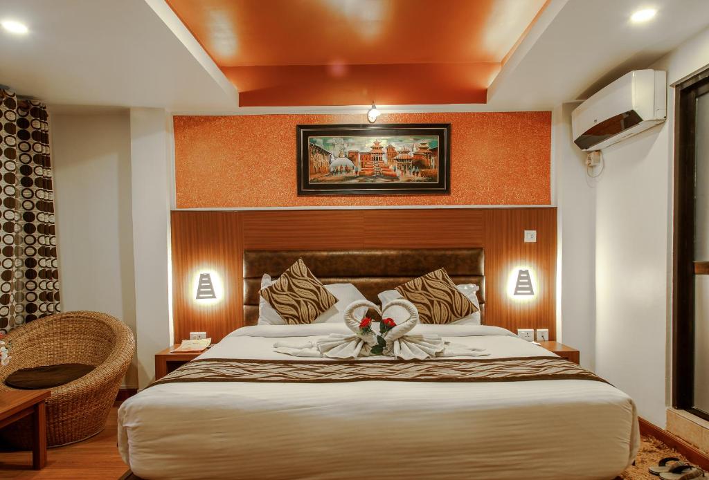 Postel nebo postele na pokoji v ubytování Hotel Shreesu