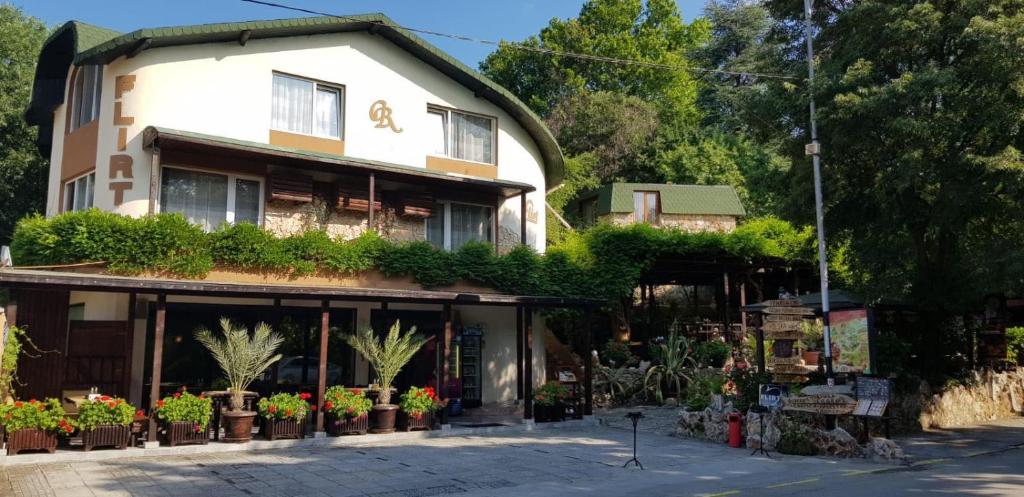a building with plants on the side of it at Guest Rooms Flirt in Golden Sands