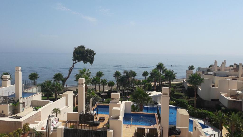 an aerial view of a resort with the ocean in the background at 103 - Beach apartment with Spa & Gym in Estepona