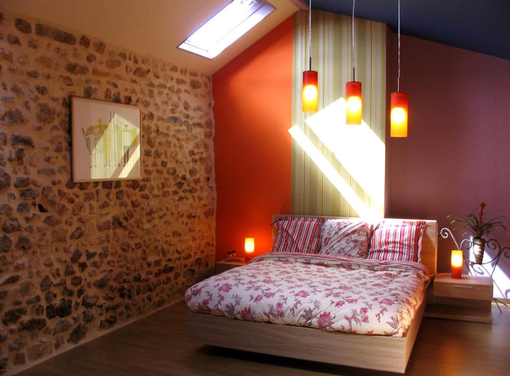 a bedroom with a bed and a window with lights at 4 Collines in Hagnicourt