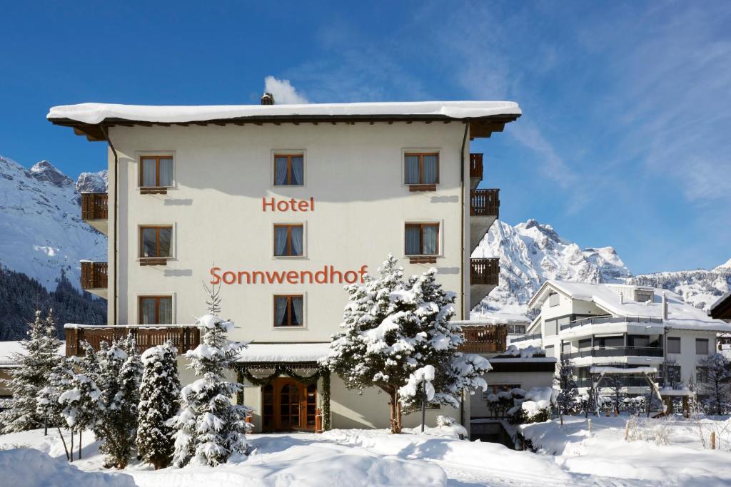 a hotel in the mountains with snow on the ground at Hotel Sonnwendhof Engelberg in Engelberg