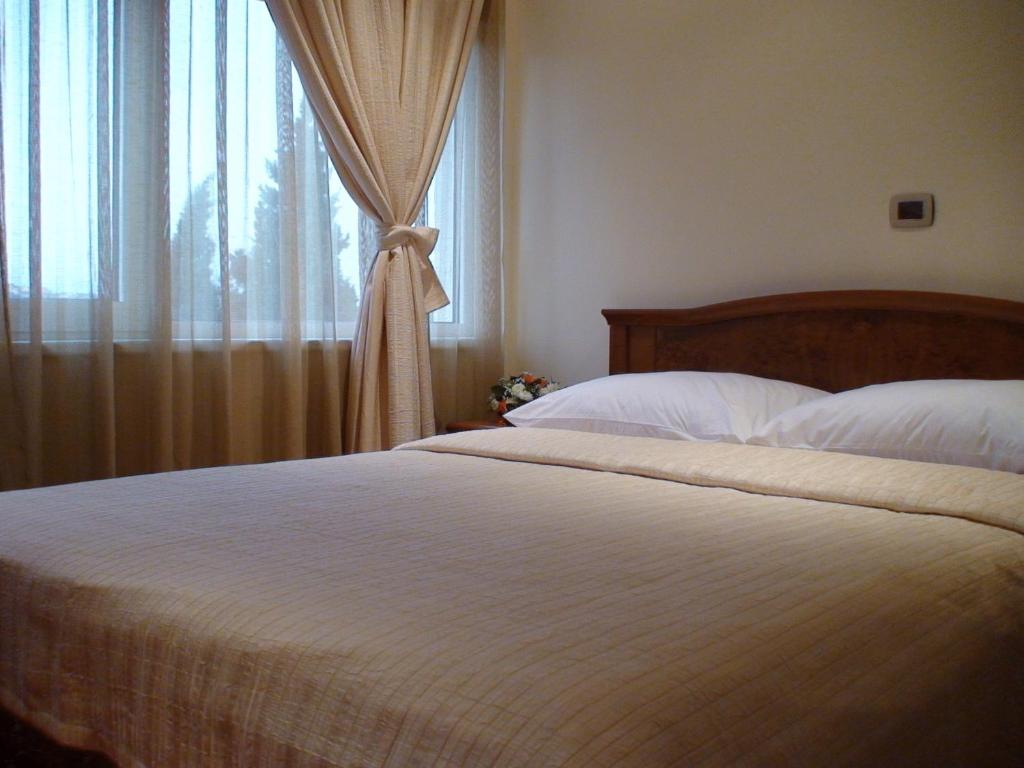 Postel nebo postele na pokoji v ubytování Mali Hotel BaMBiS
