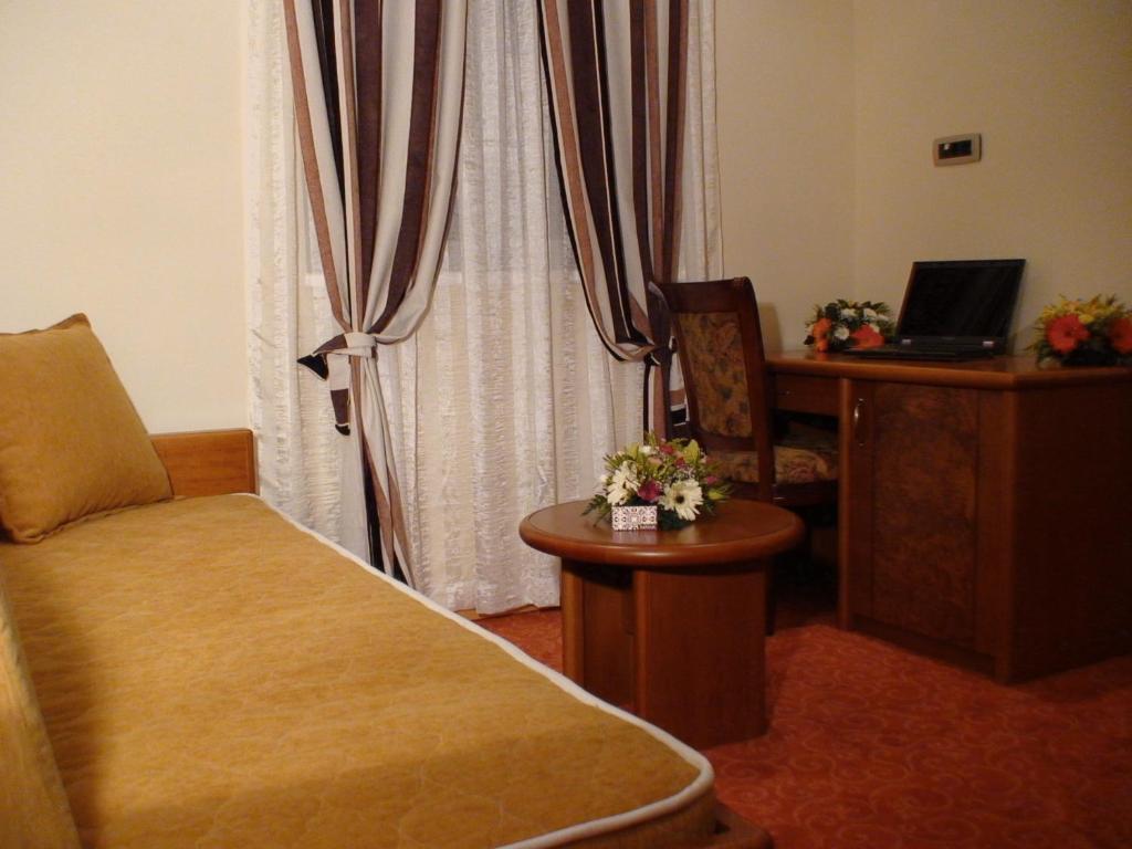 Postel nebo postele na pokoji v ubytování Mali Hotel BaMBiS