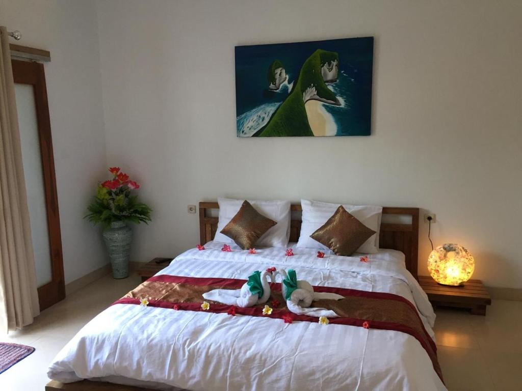 Postel nebo postele na pokoji v ubytování PITAMATA VILLAS
