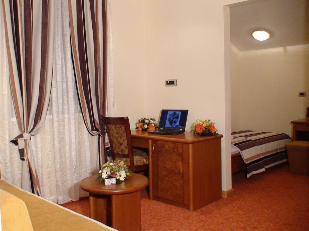 Postel nebo postele na pokoji v ubytování Mali Hotel BaMBiS