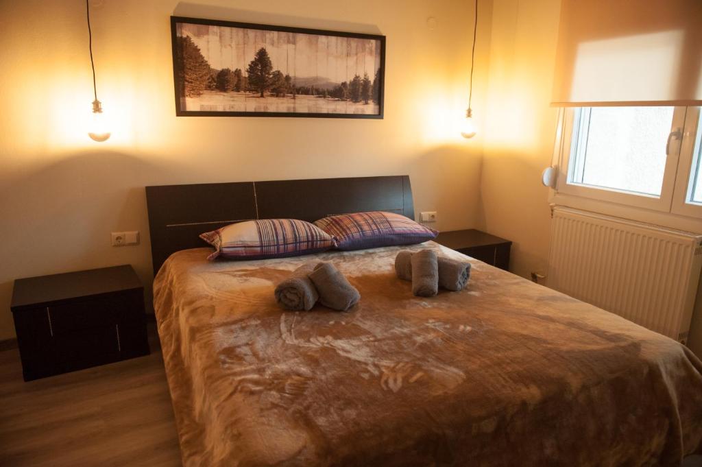 Postel nebo postele na pokoji v ubytování S.K.Suite