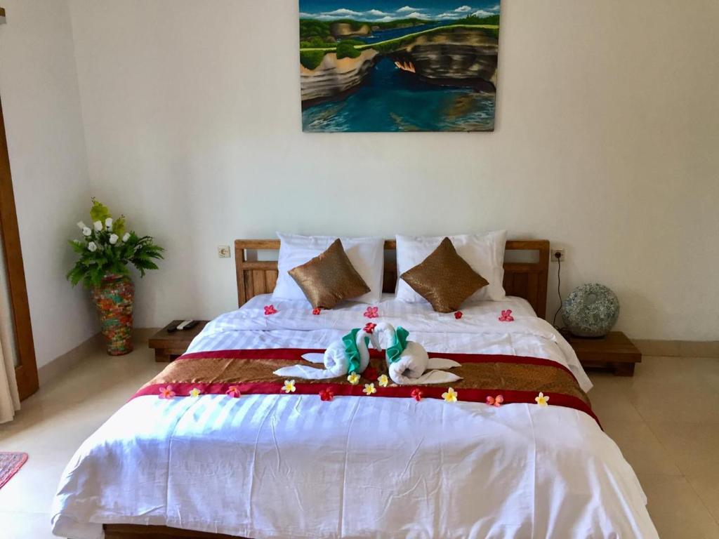 Postel nebo postele na pokoji v ubytování PITAMATA VILLAS