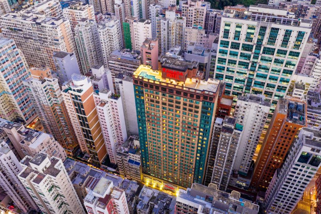 an overhead view of a city with tall buildings at Ramada Hong Kong Grand View in Hong Kong