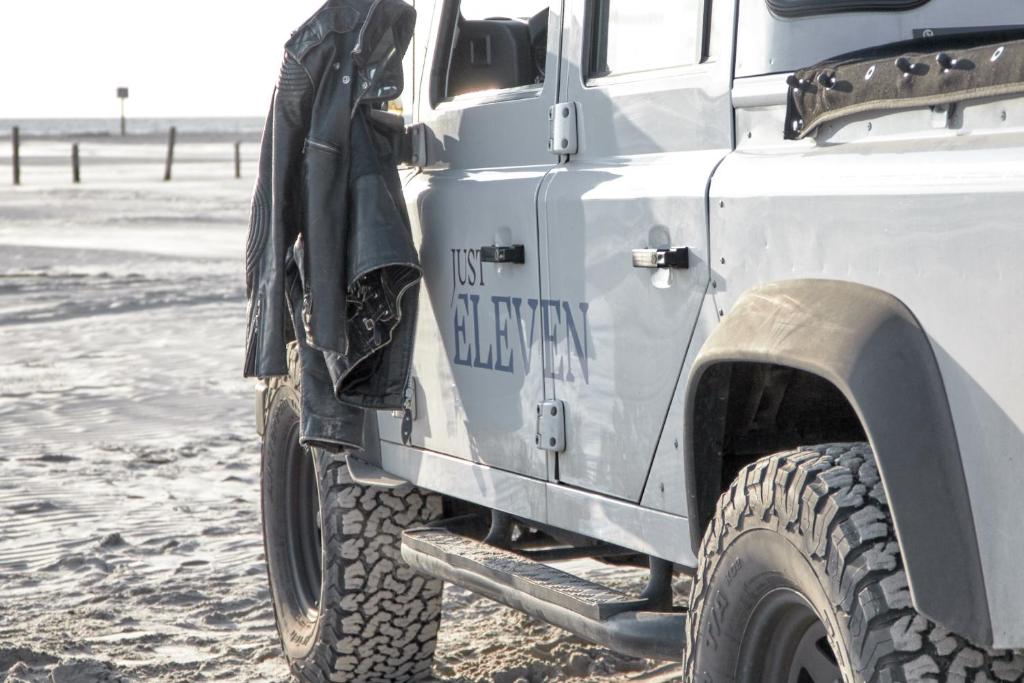 a close up of a military truck parked in the snow at Just Eleven in Sankt Peter-Ording