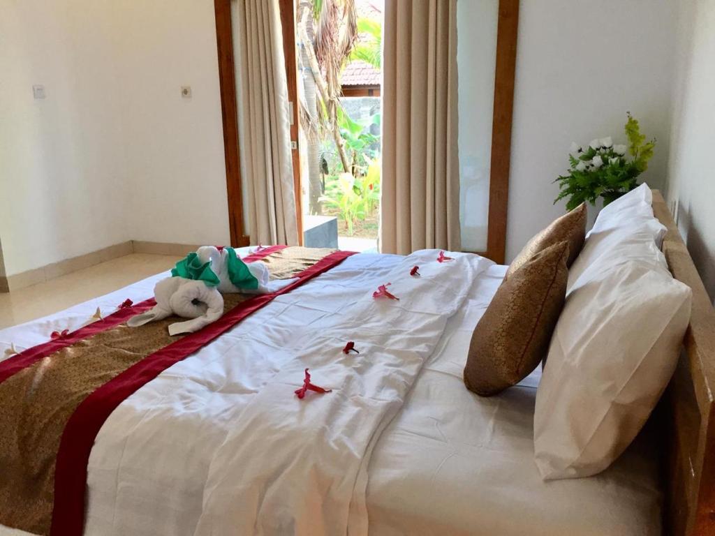 Postel nebo postele na pokoji v ubytování PITAMATA VILLAS