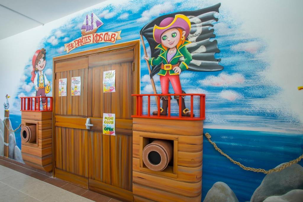 a room with a mural of a girl on the wall at Leonardo Cypria Bay in Paphos