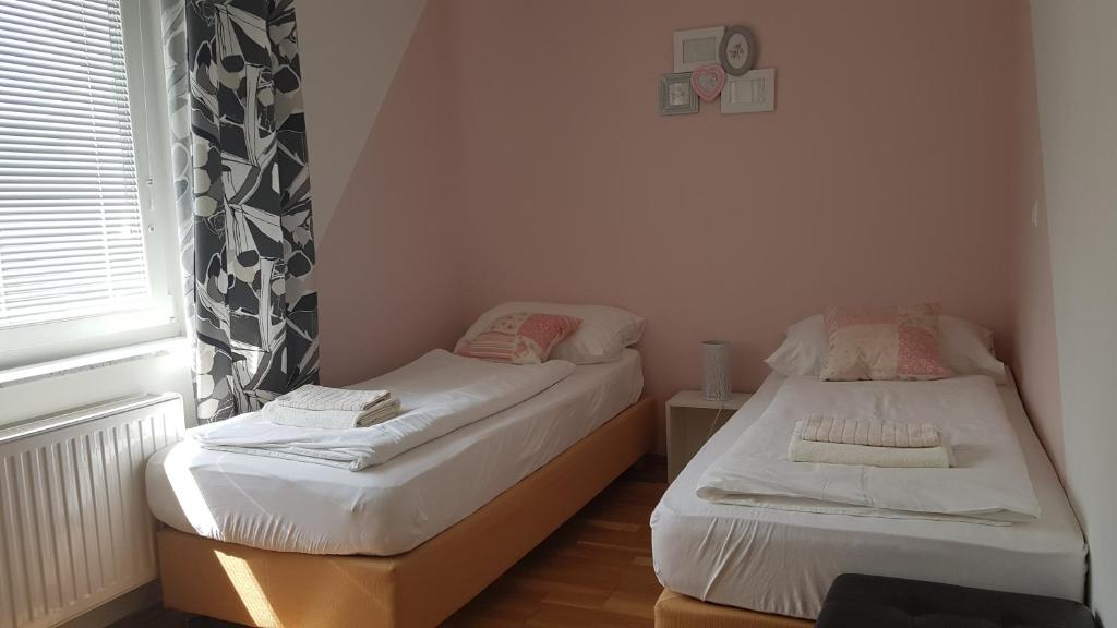 Postel nebo postele na pokoji v ubytování Bled Apartments