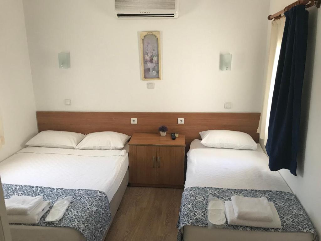 Postel nebo postele na pokoji v ubytování Tay Pansiyon