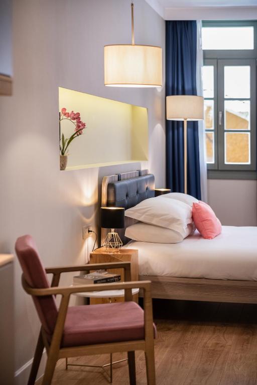 Voodi või voodid majutusasutuse Viaggio Elegant Rooms toas