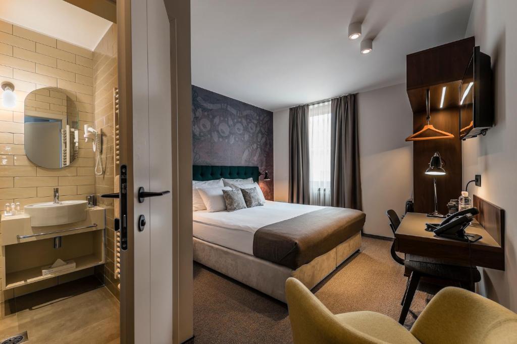 Postel nebo postele na pokoji v ubytování Hotel Mrak