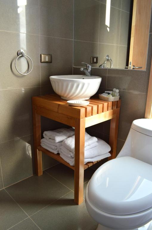 Koupelna v ubytování Apart Hotel Quillango