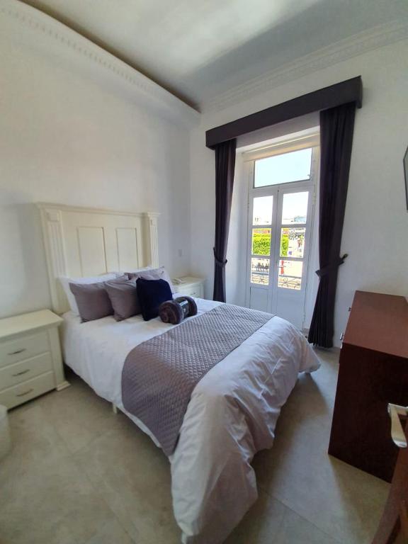 Postel nebo postele na pokoji v ubytování Hotel Estancia Real