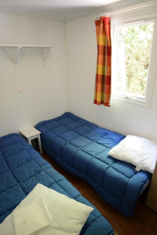 Postel nebo postele na pokoji v ubytování camping rochecondrie