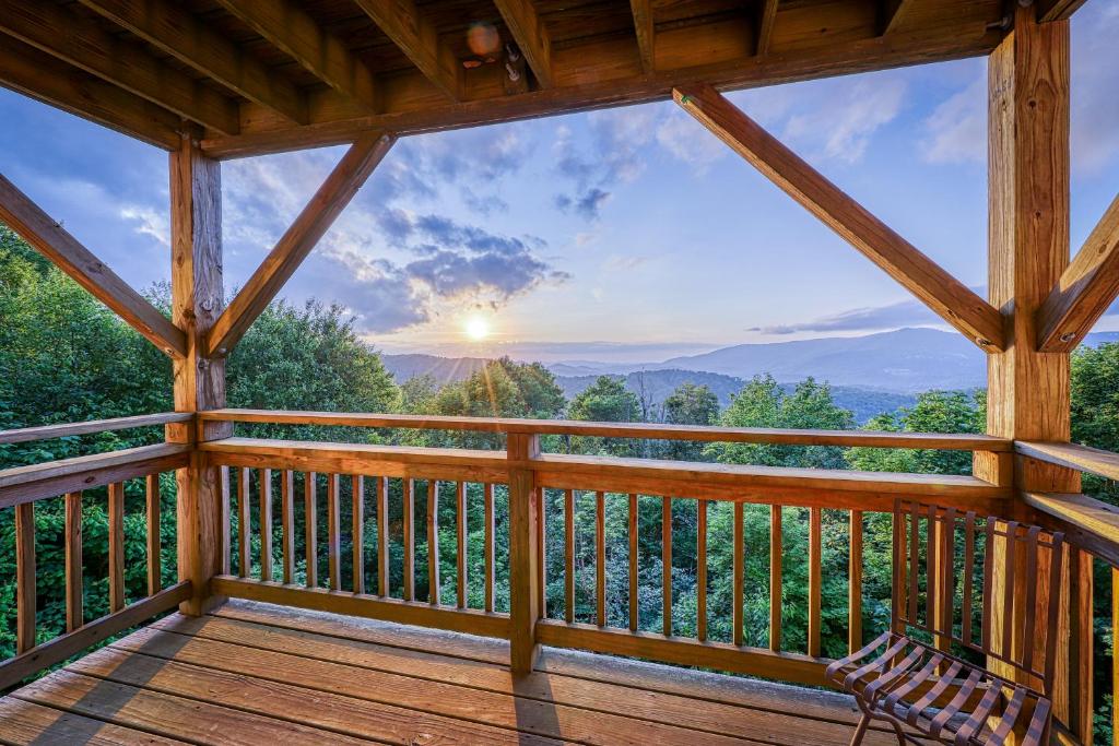 a cabin balcony with a view of the mountains at Crest 100E in Sugar Mountain