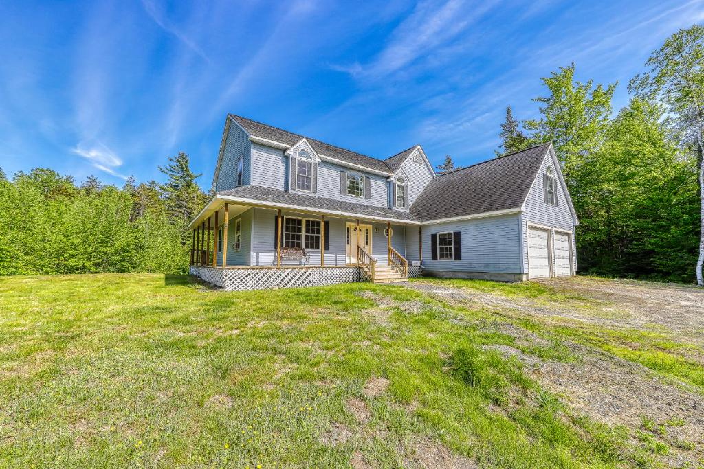 a home on a hill with a large yard at Franconia's Far Far Away in Franconia