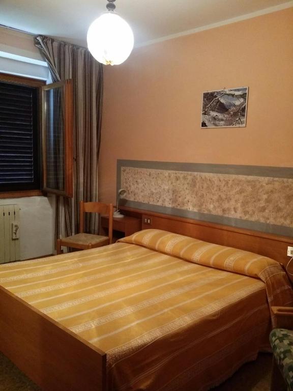 Postel nebo postele na pokoji v ubytování Albergo la Valle