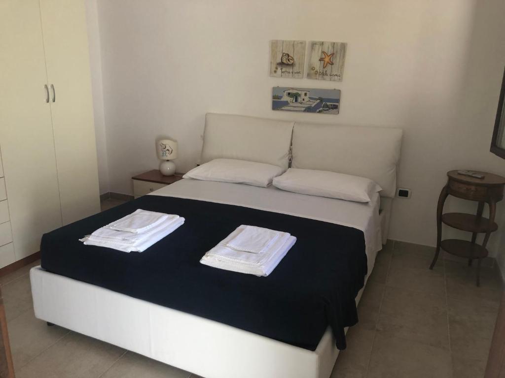 Postel nebo postele na pokoji v ubytování Hibiscus B&B