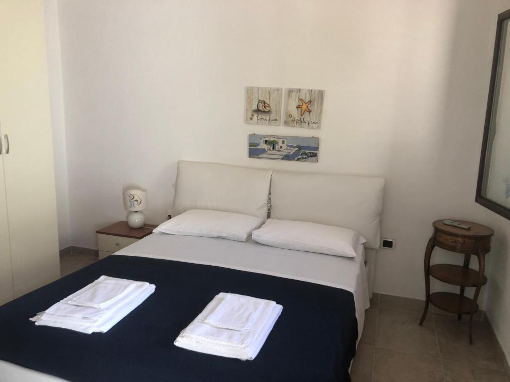Postel nebo postele na pokoji v ubytování Hibiscus B&B