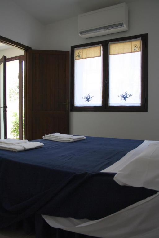 Postel nebo postele na pokoji v ubytování Hibiscus B&B