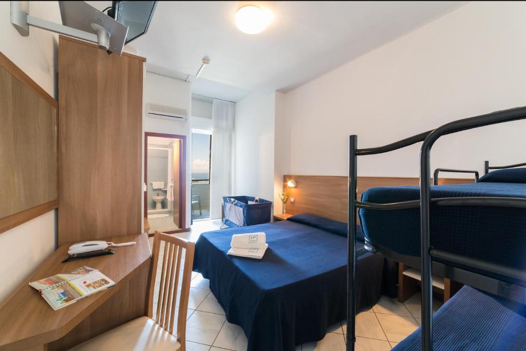 Postel nebo postele na pokoji v ubytování Hotel Promenade