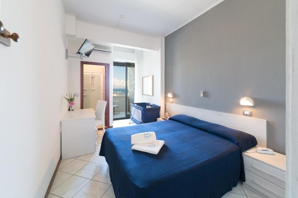 Postel nebo postele na pokoji v ubytování Hotel Promenade
